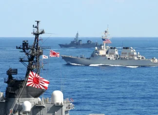 Australia Japan US Agree Naval Logistics Deal US Navy 101210 N 7191M 031 U.S. Navy and Japan Maritime Self Defense Force JMSDF ships underway in formation as part of a photo exercise on the f e1564762995289