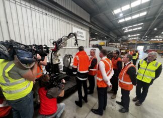 Century Engineering wins first US defence export contracts Government officials look over 3D printing at Century Engineering workshop